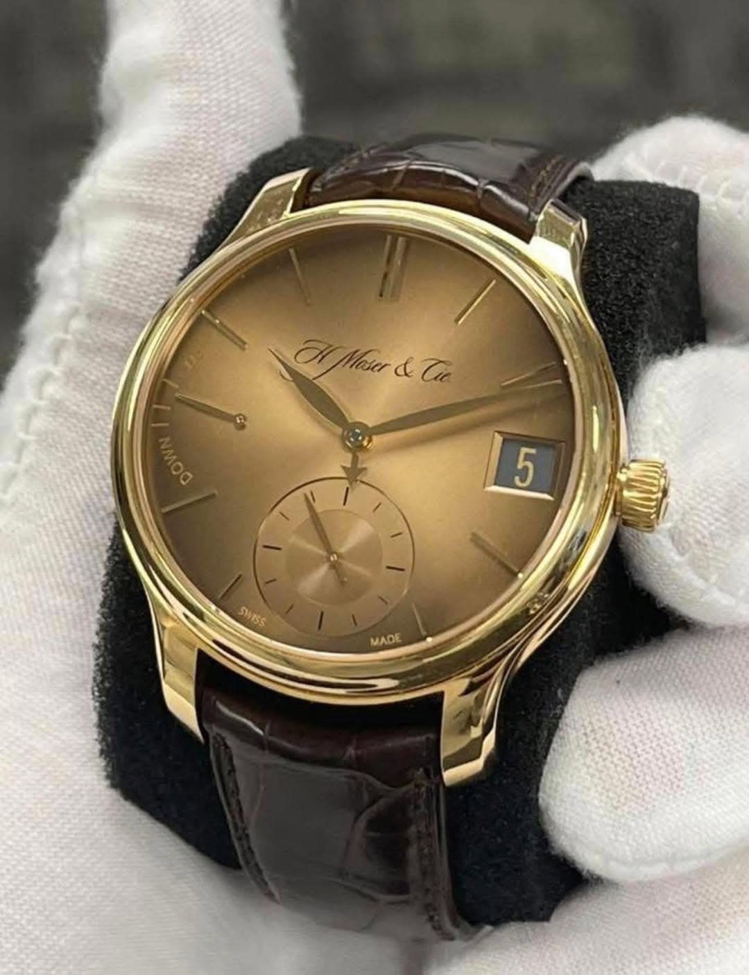 May be an image of wrist watch and text