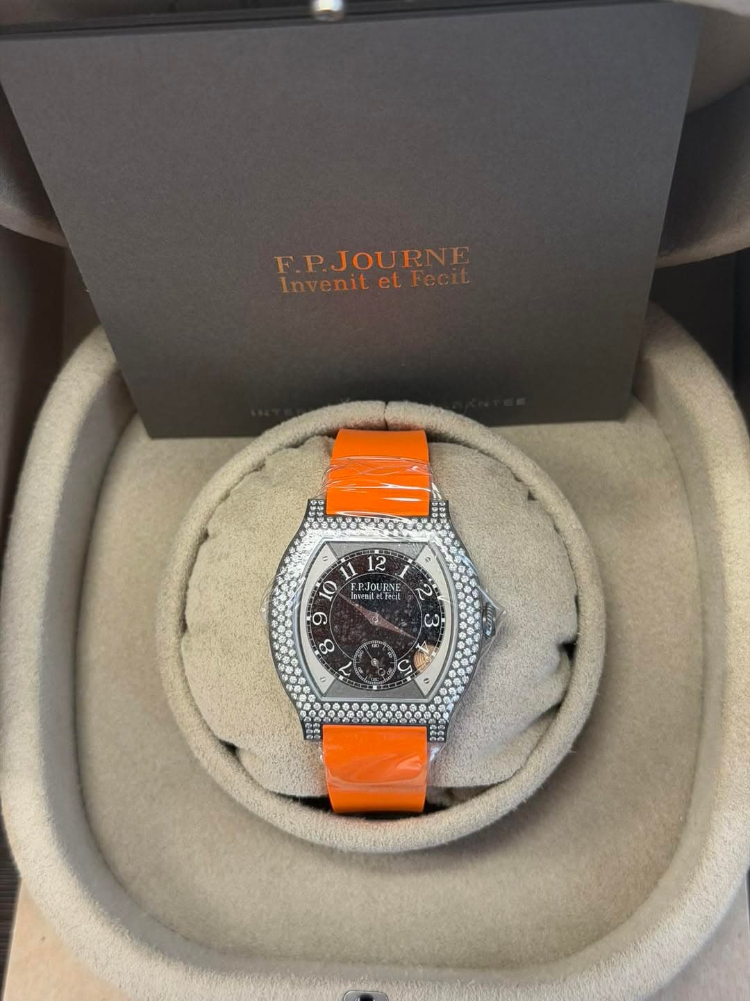 May be an image of wrist watch and text