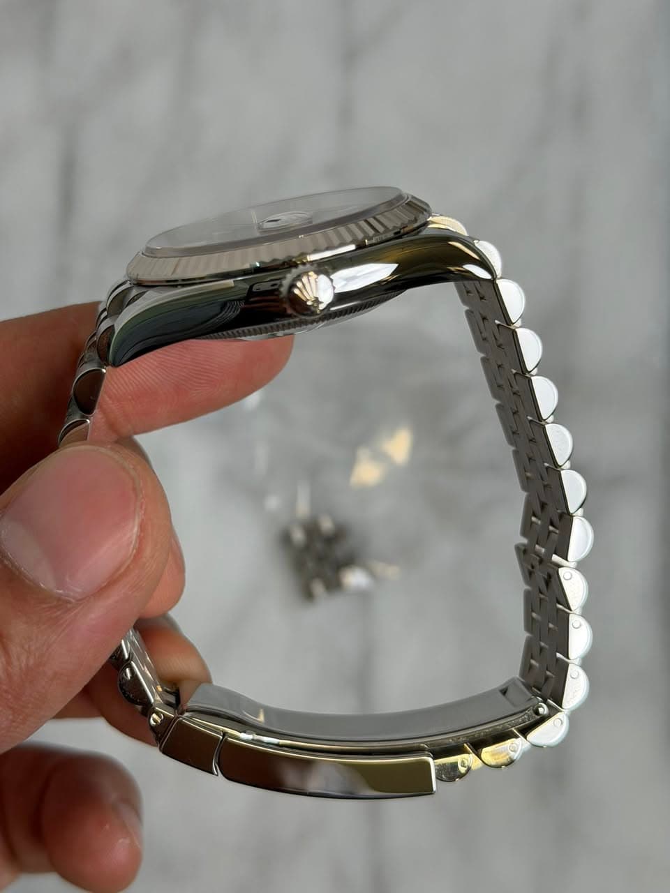May be an image of jewelry and wrist watch