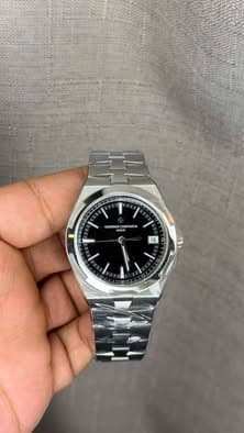 May be an image of wrist watch and text