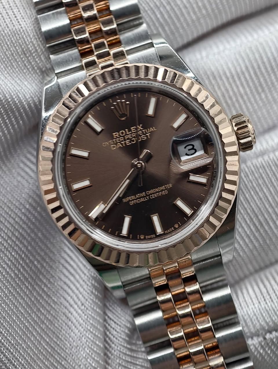May be an image of wrist watch and text