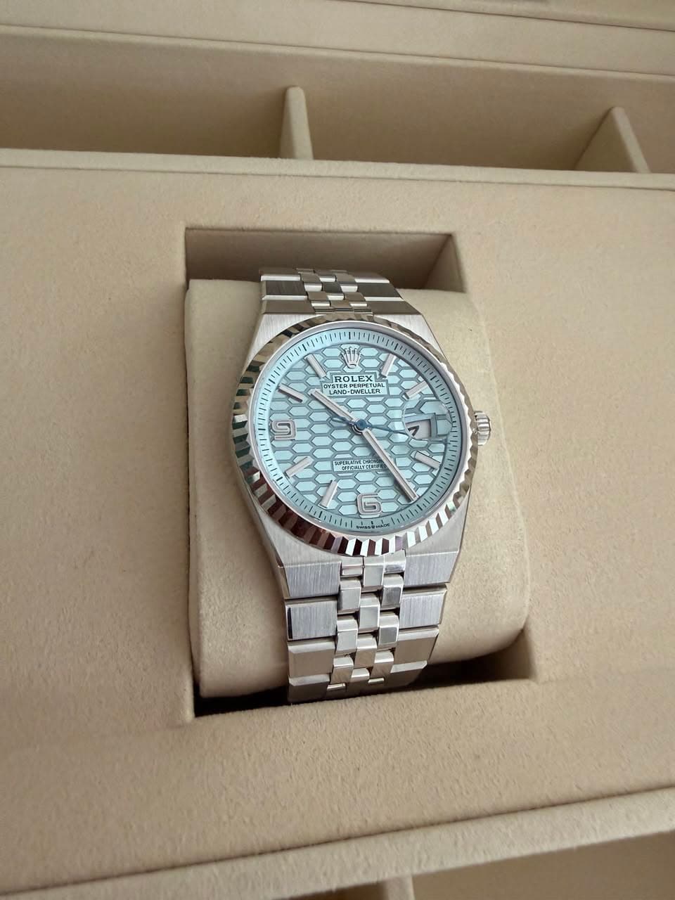 May be an image of wrist watch and text