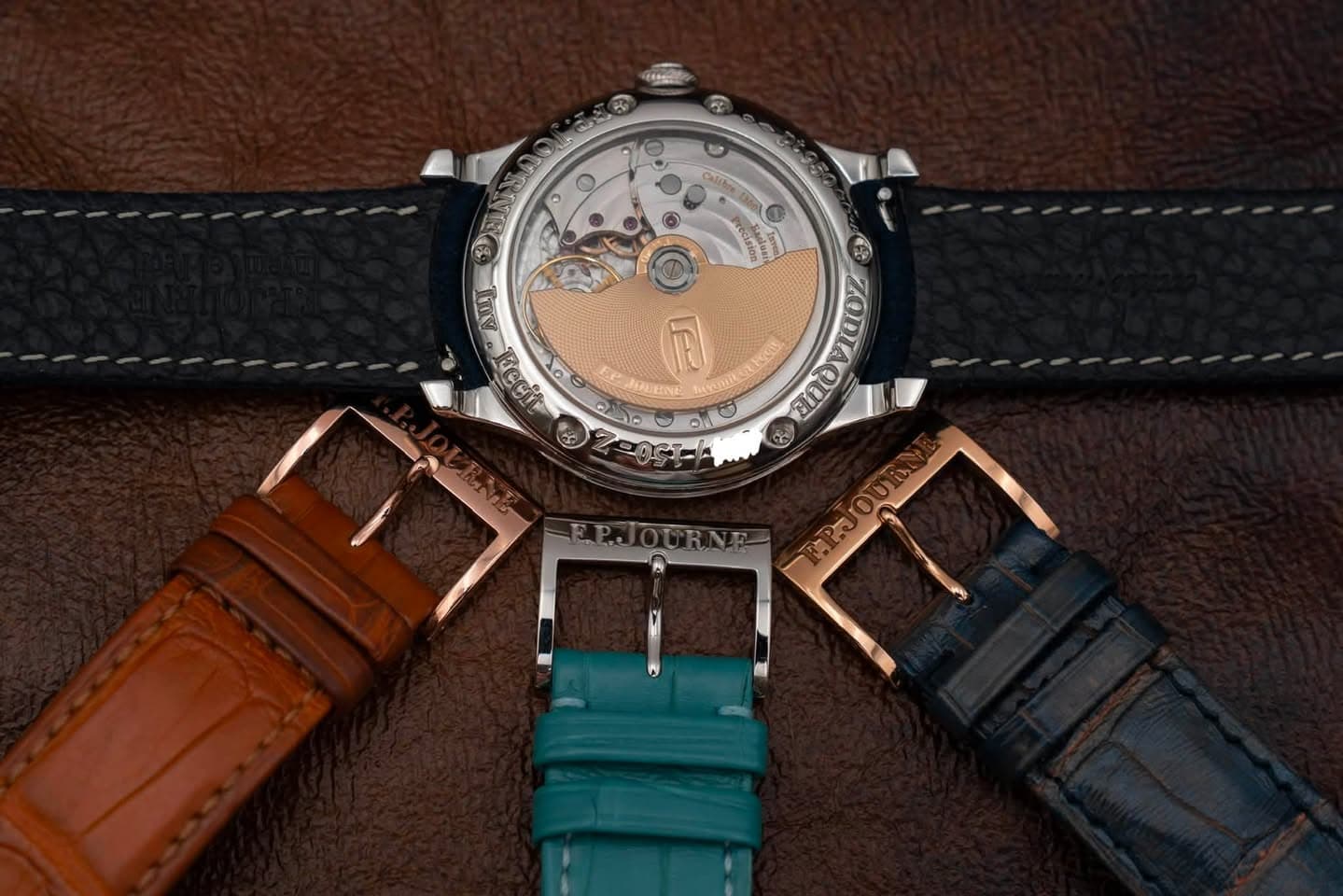 May be an image of leather, wrist watch and text