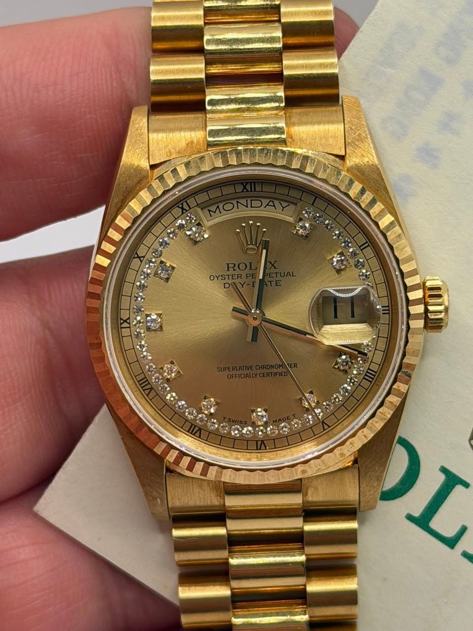 May be an image of wrist watch and text