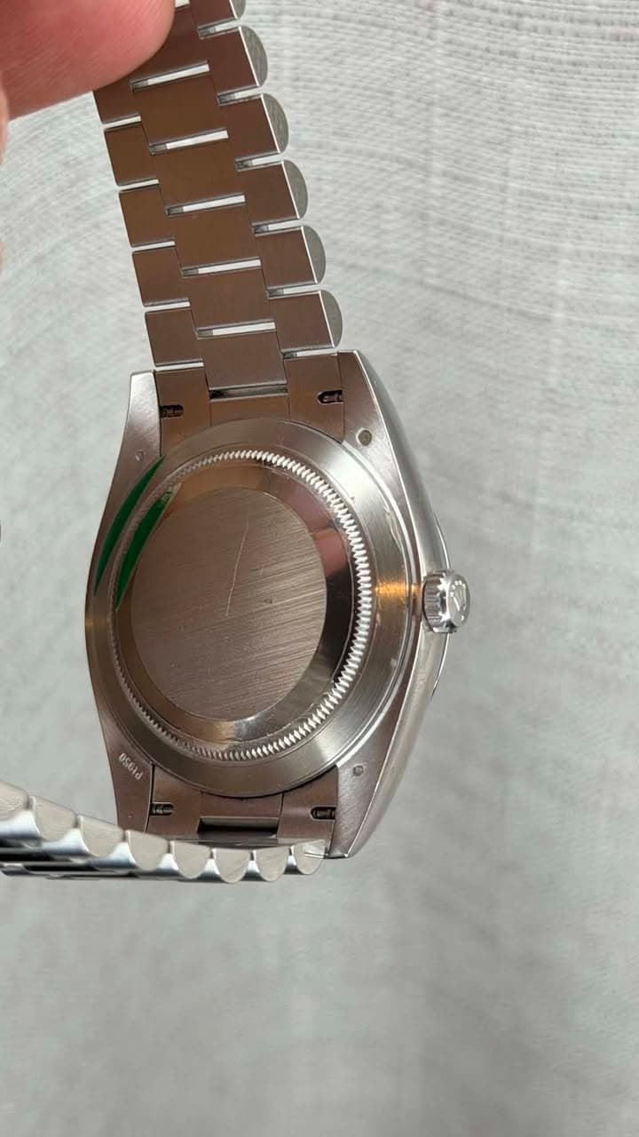 May be an image of wrist watch and text