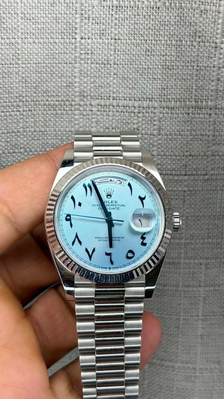 May be an image of wrist watch and text