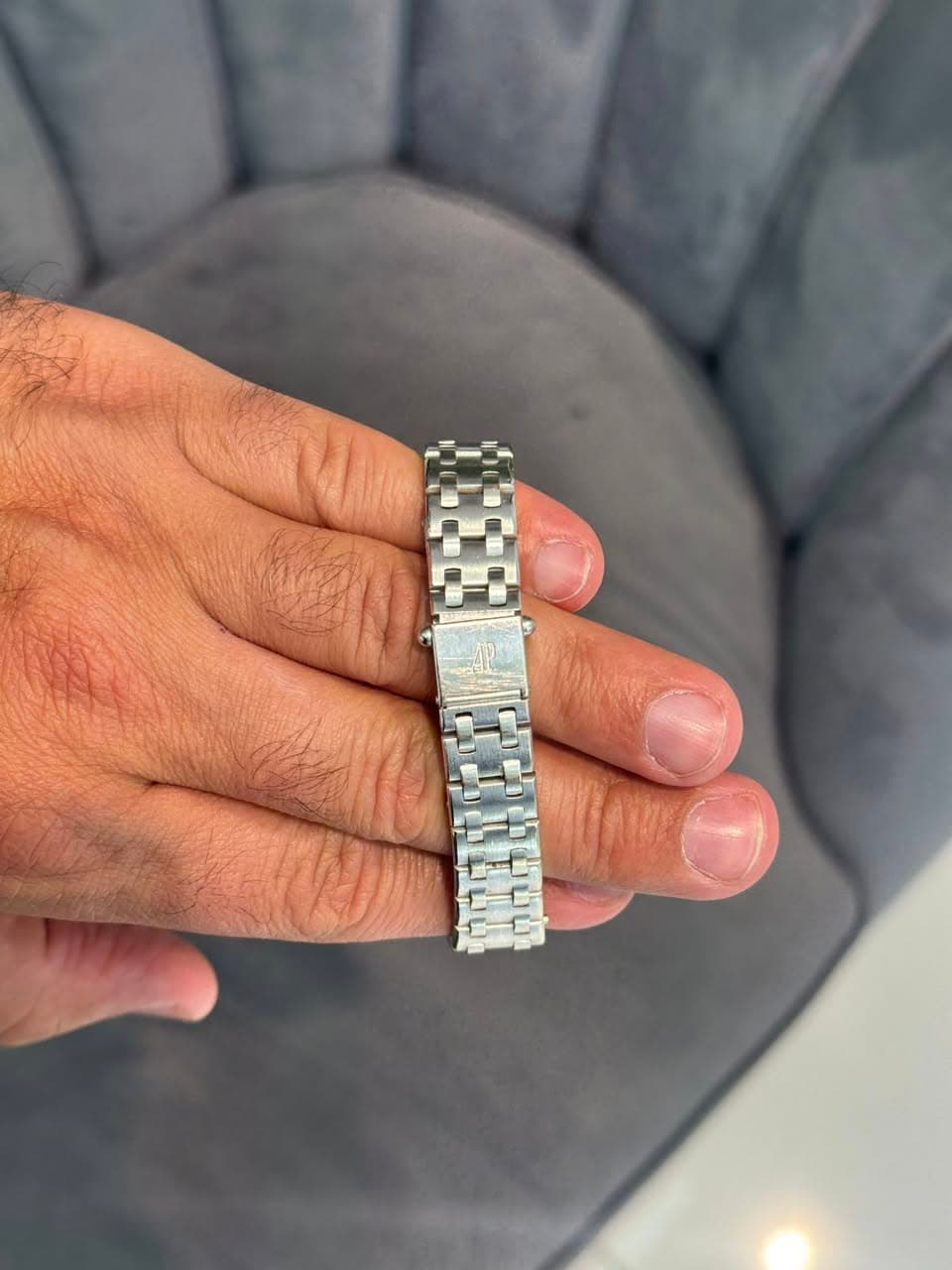 May be an image of wrist watch and text