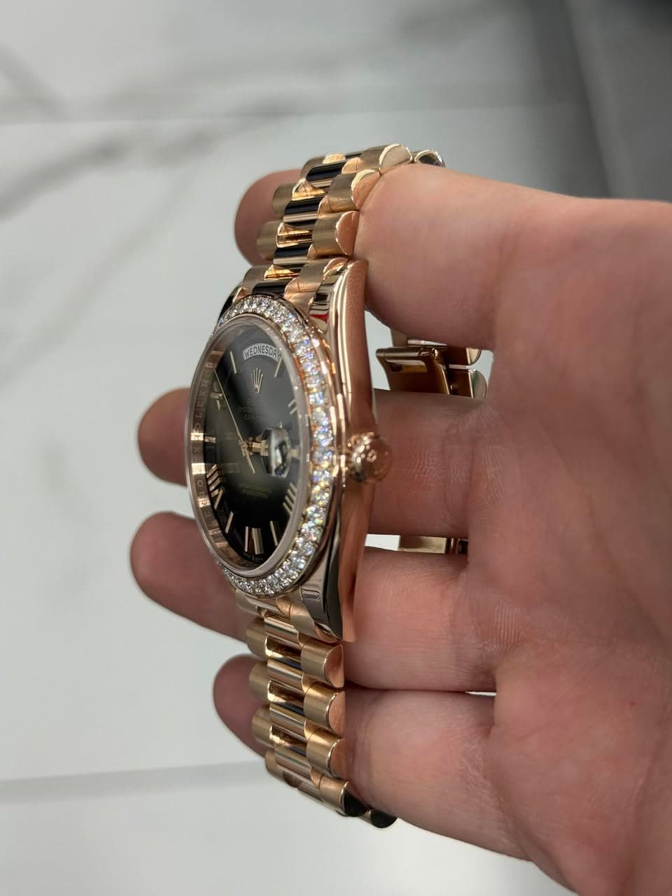May be an image of wrist watch and text