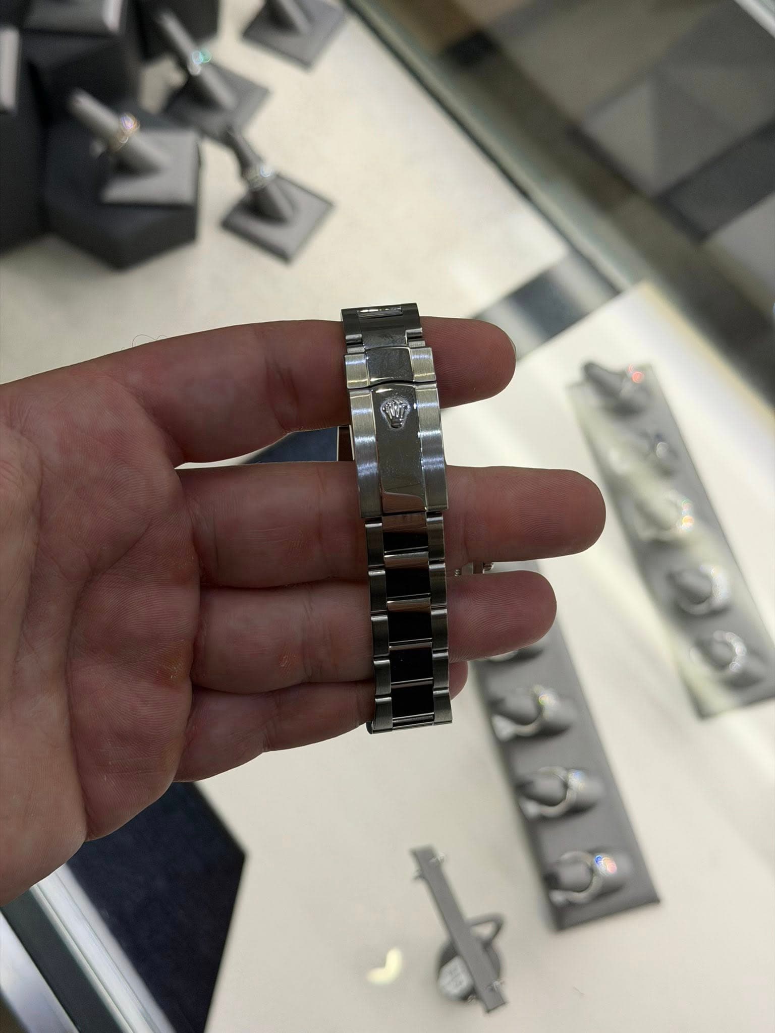 May be an image of wrist watch and text
