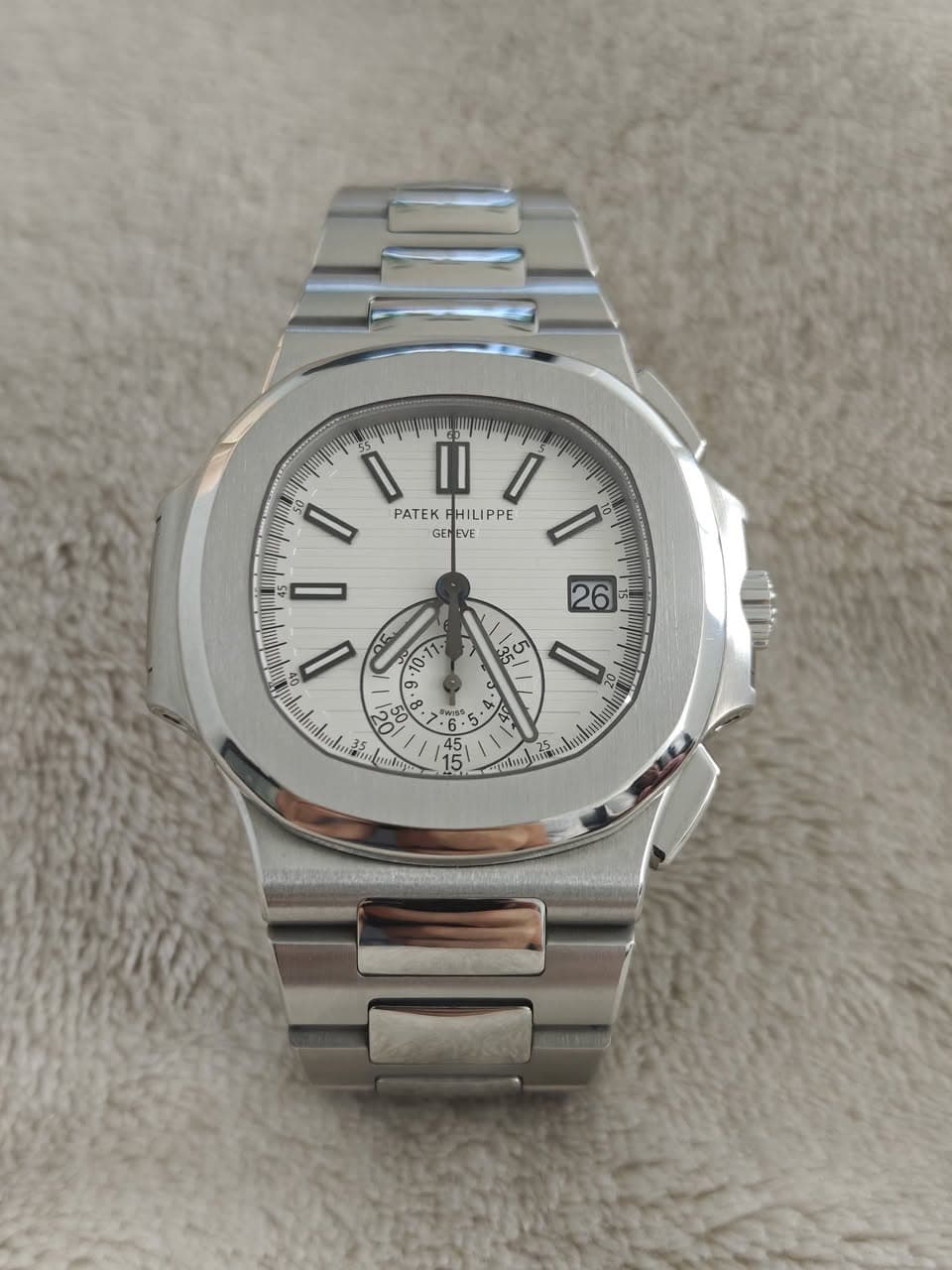 May be an image of wrist watch and text