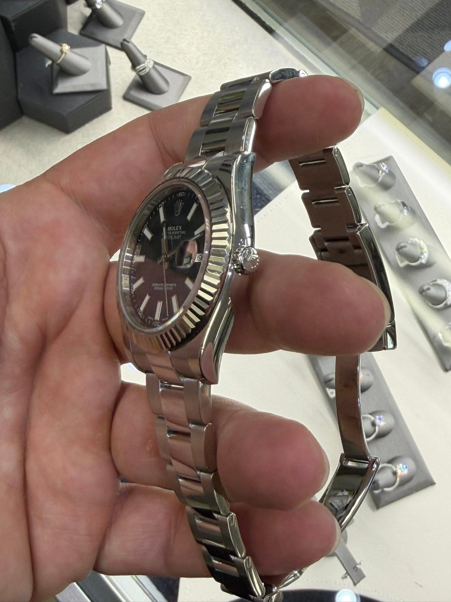 May be an image of wrist watch and text