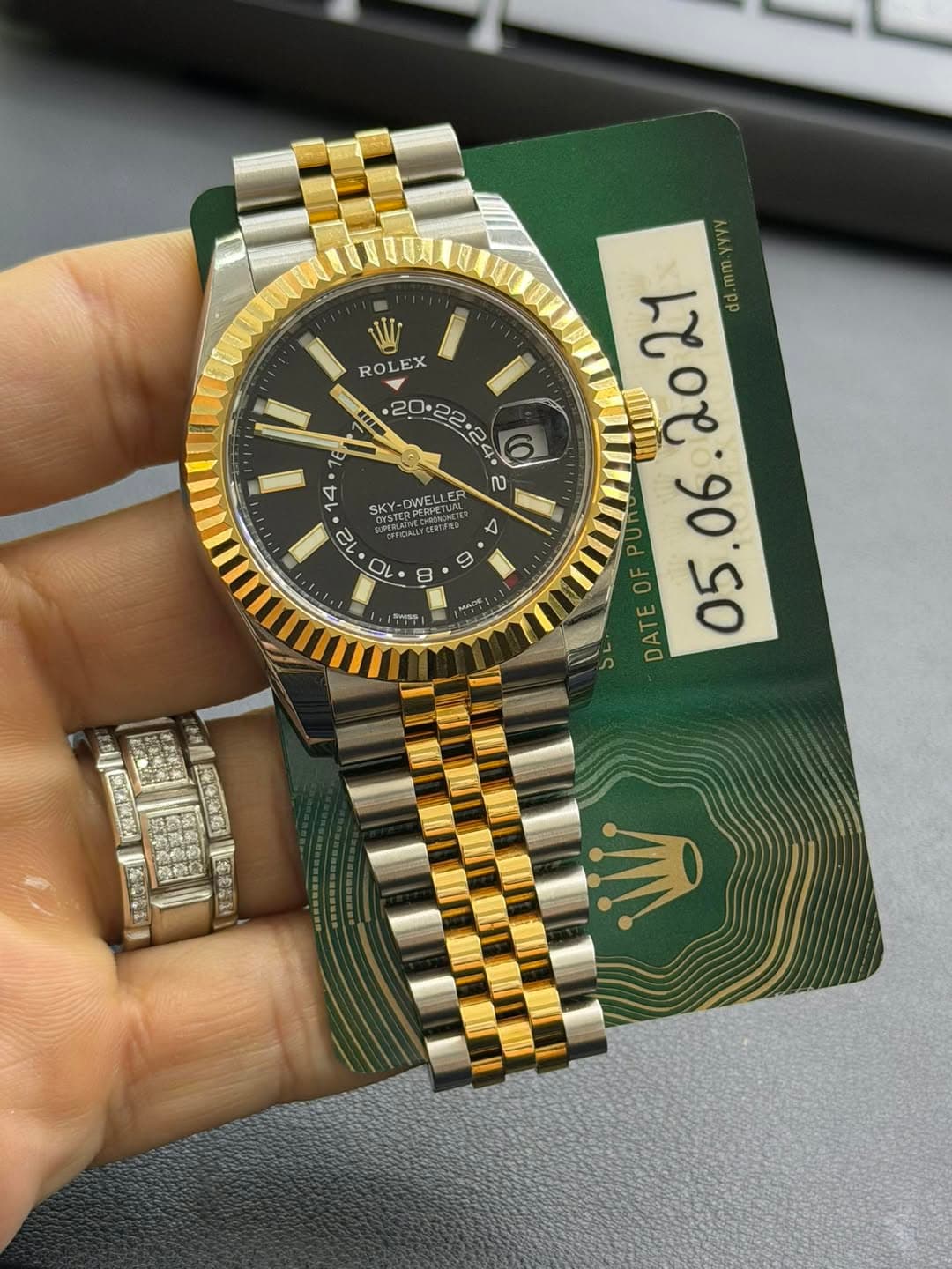 May be an image of wrist watch and text