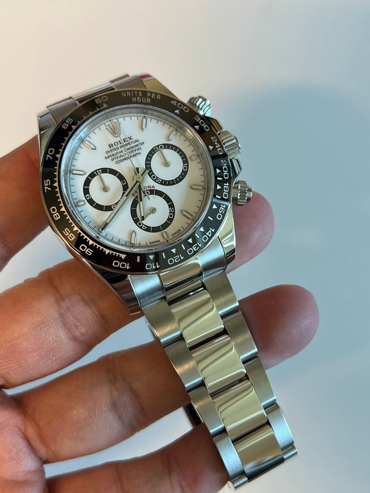 May be an image of wrist watch and text