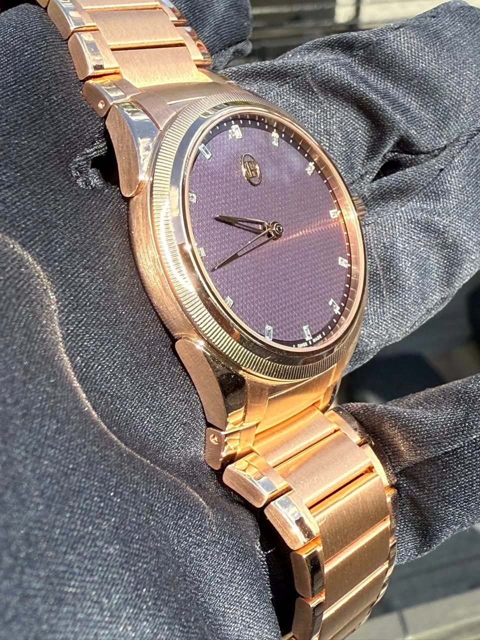May be an image of wrist watch and text
