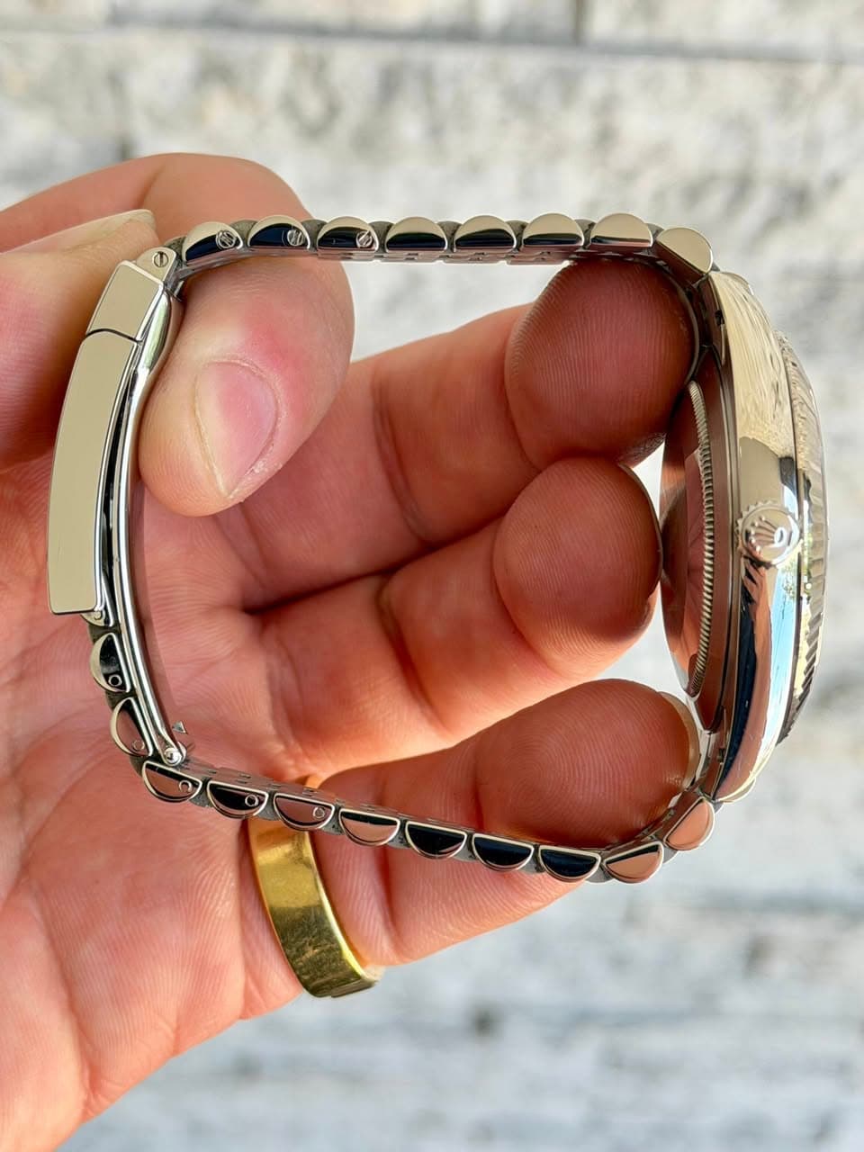 May be an image of jewelry and wrist watch