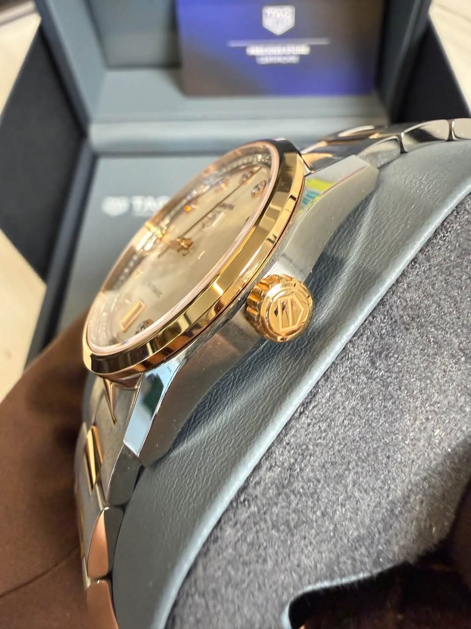 May be an image of wrist watch and text