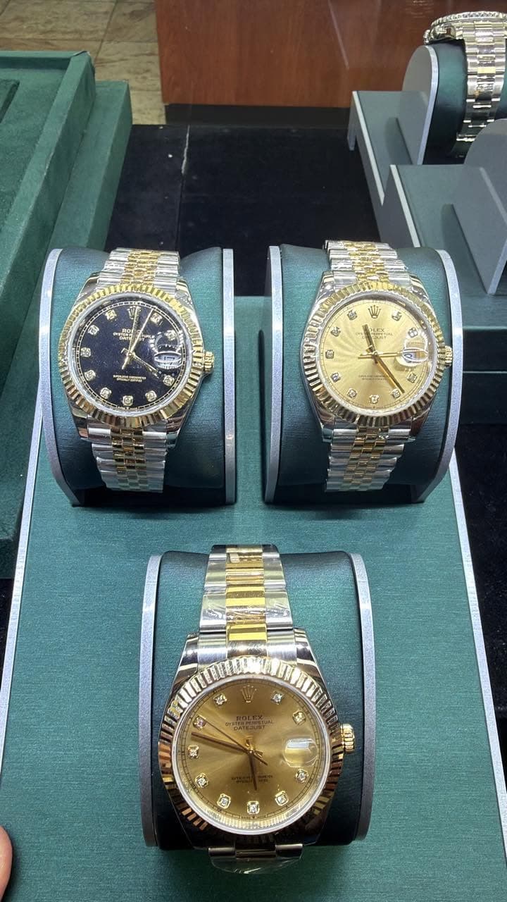 May be an image of wrist watch and text