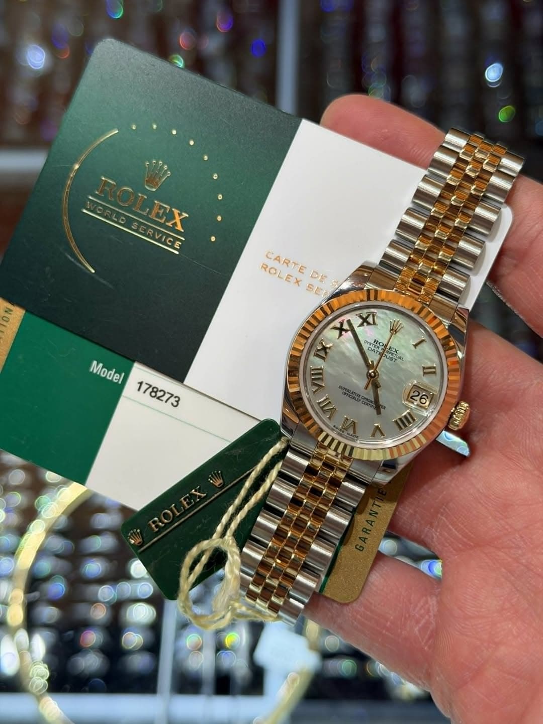 May be an image of wrist watch and text