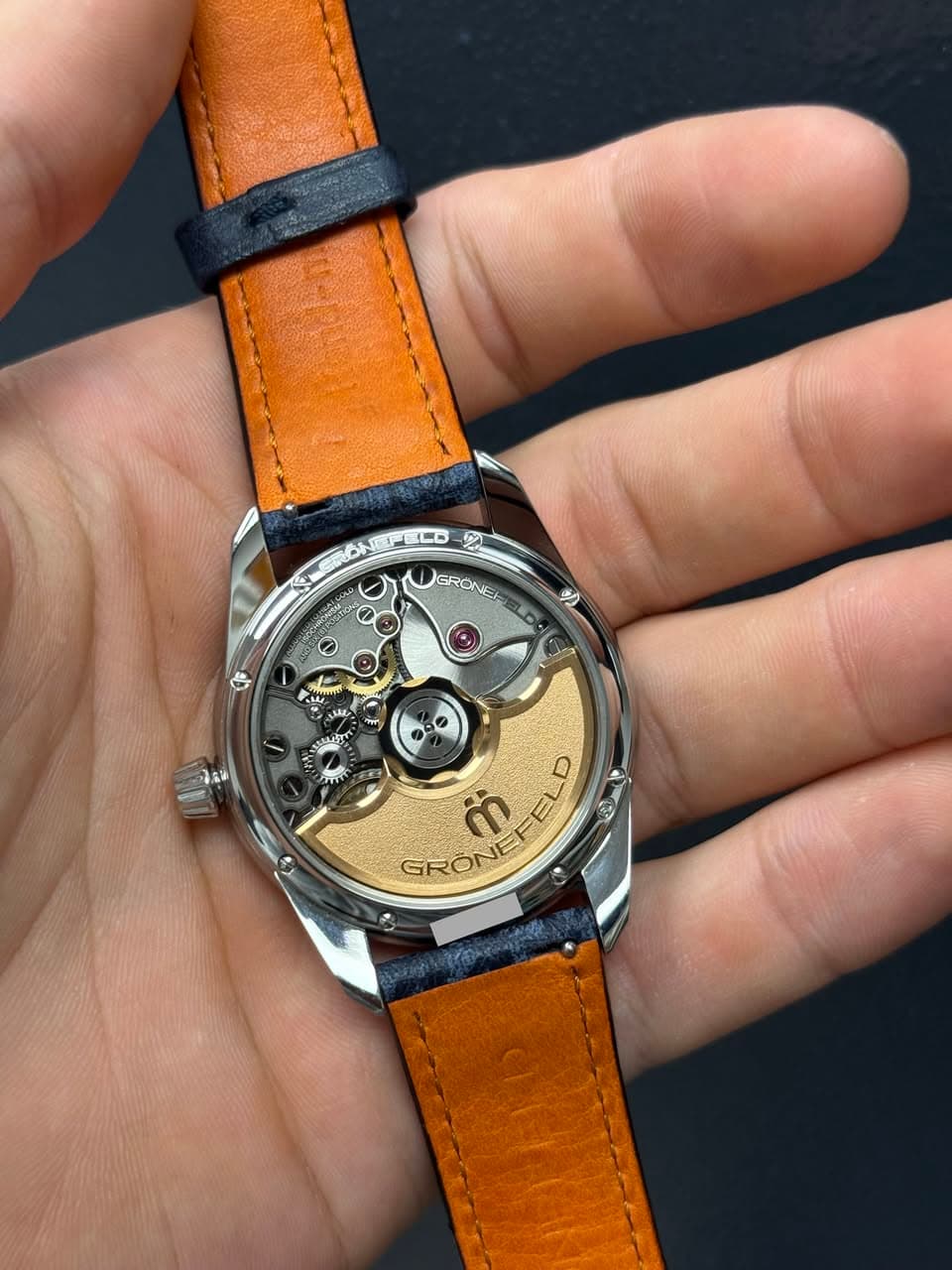 May be an image of wrist watch and text
