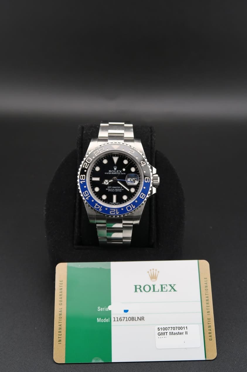 May be an image of wrist watch and text that says '2 4 aECRL 20 18 9 U ROLEX Serian p Model 116710BLNR A GMT Master II GARANTIE'
