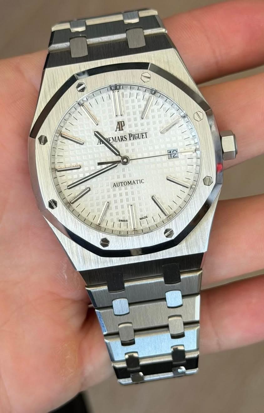 May be an image of wrist watch and text