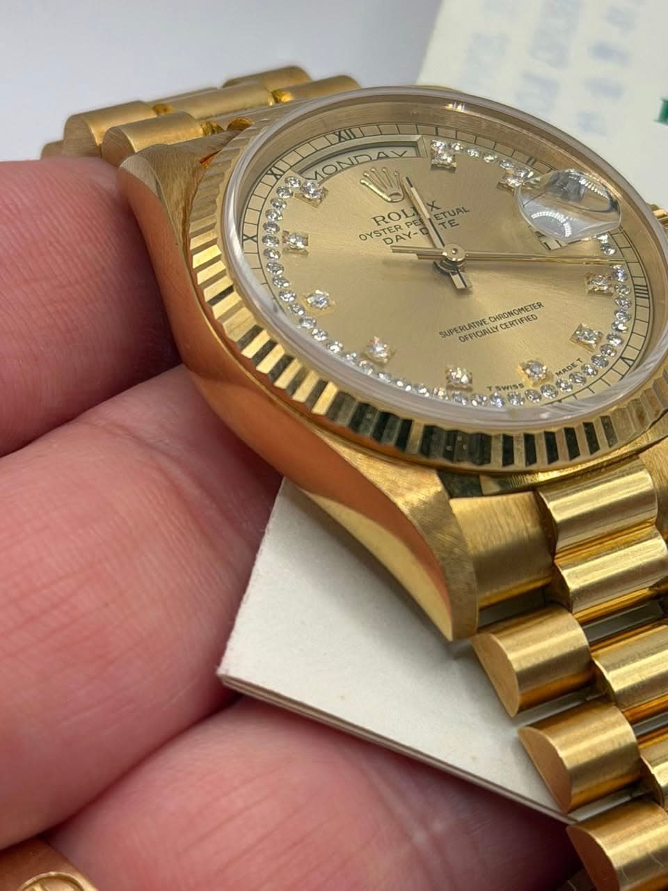 May be an image of wrist watch and text