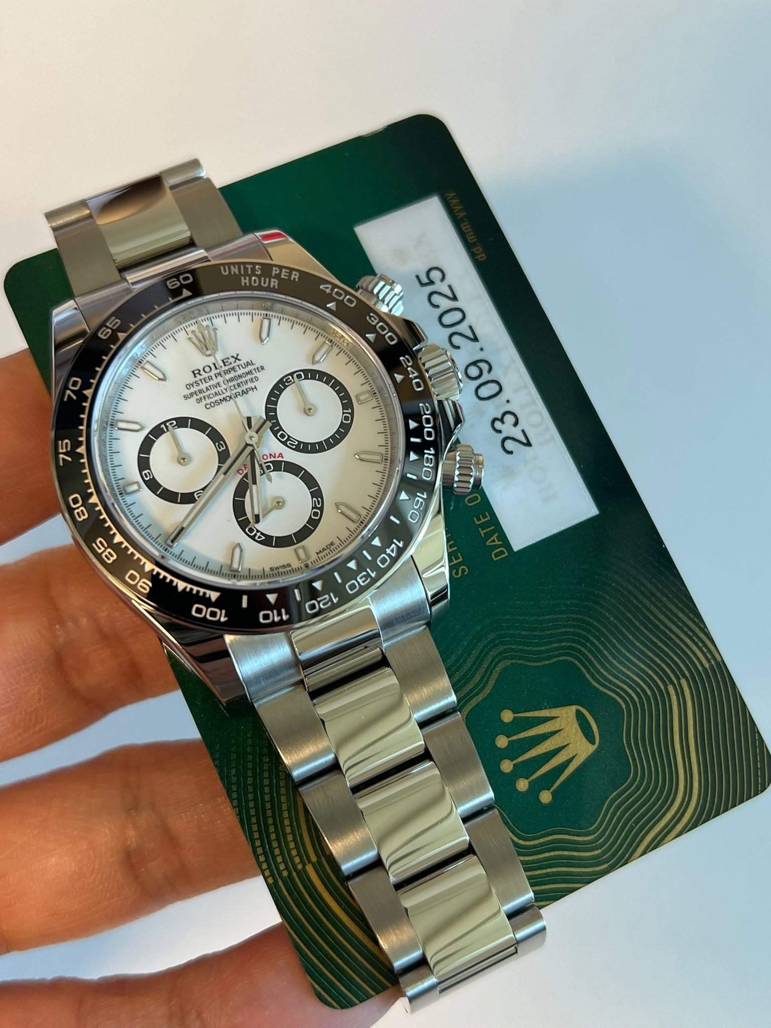 May be an image of wrist watch and text