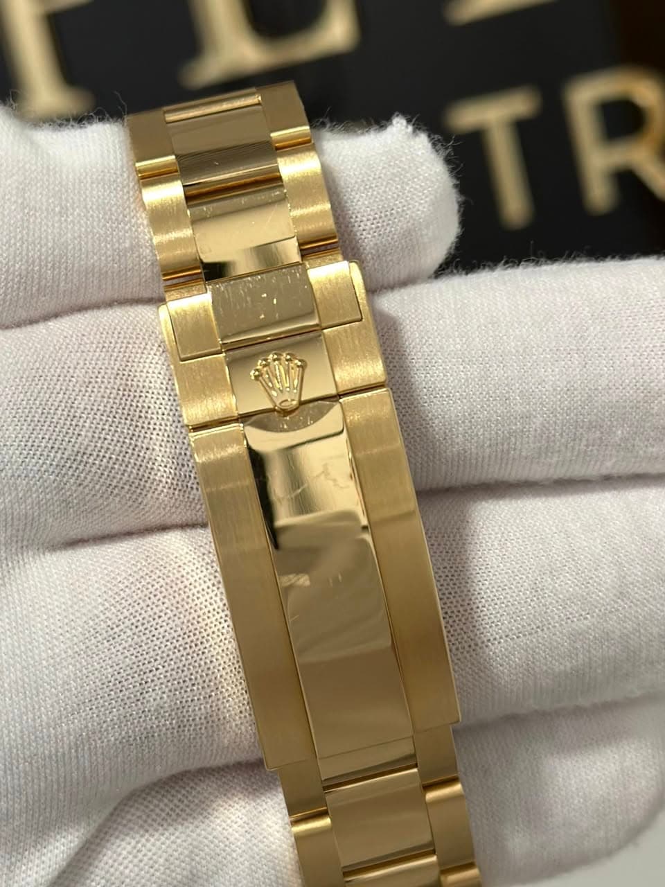 May be an image of wrist watch and text