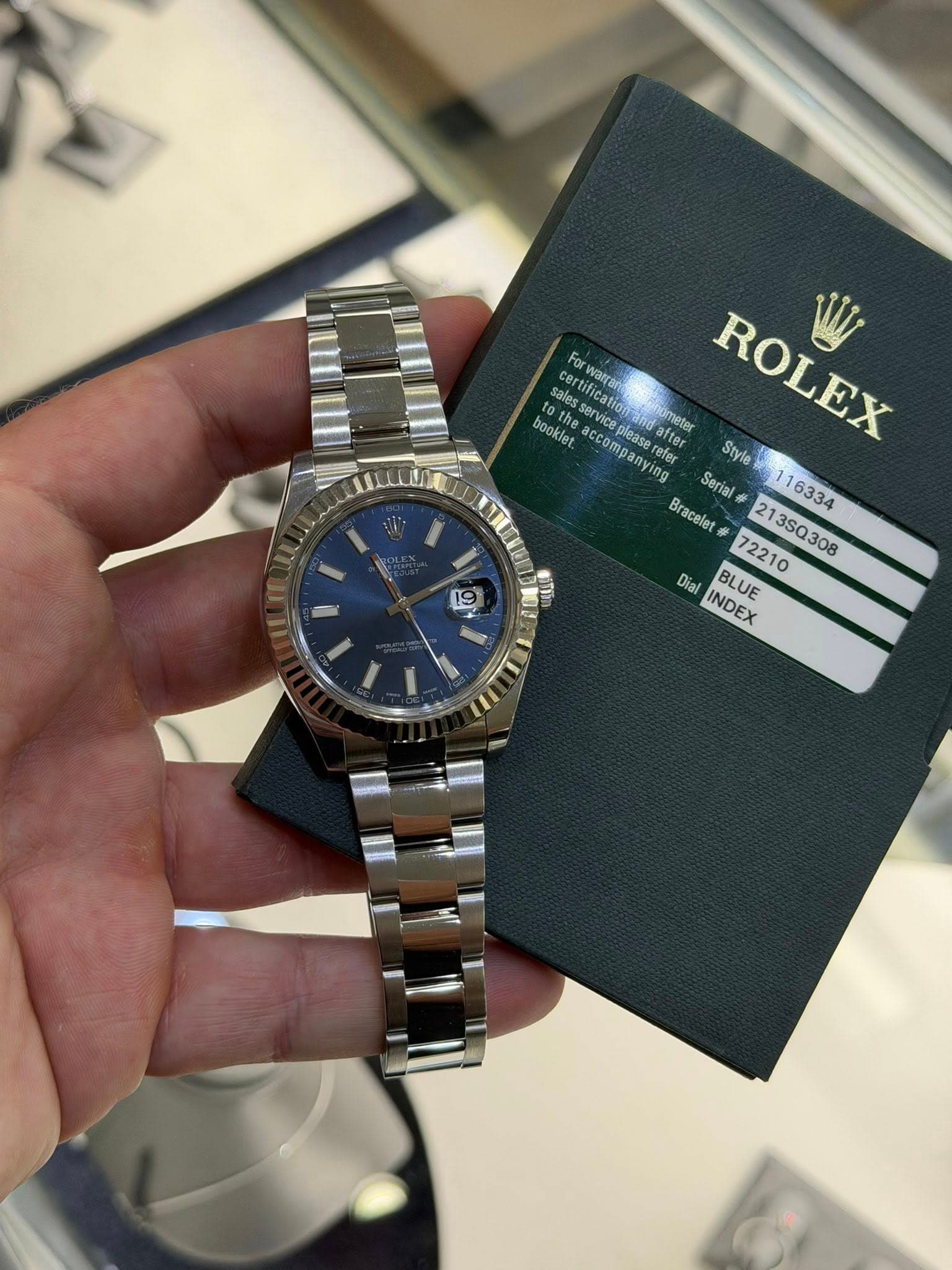 May be an image of wrist watch and text