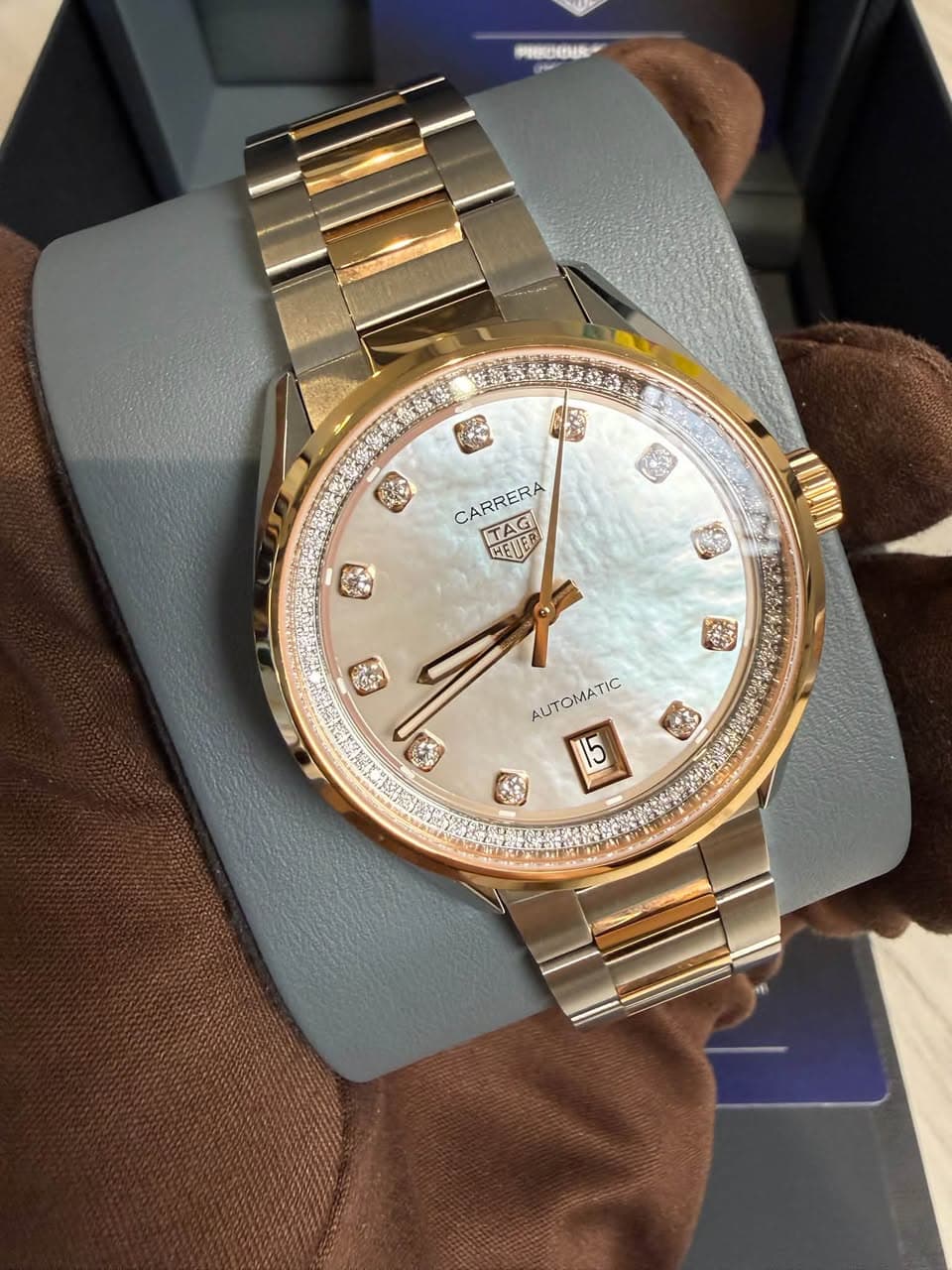 May be an image of wrist watch and text