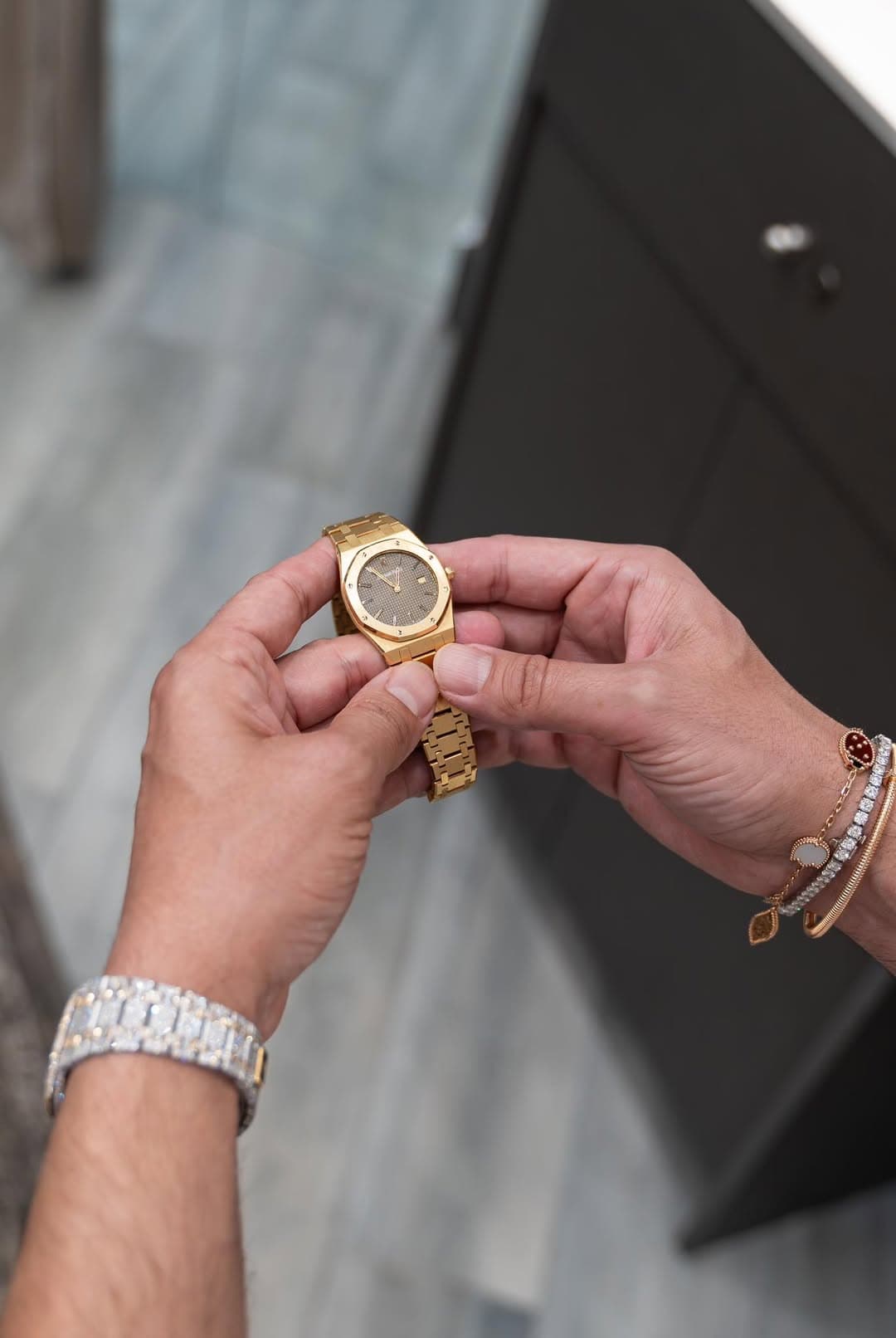 May be an image of wrist watch, jewelry and text