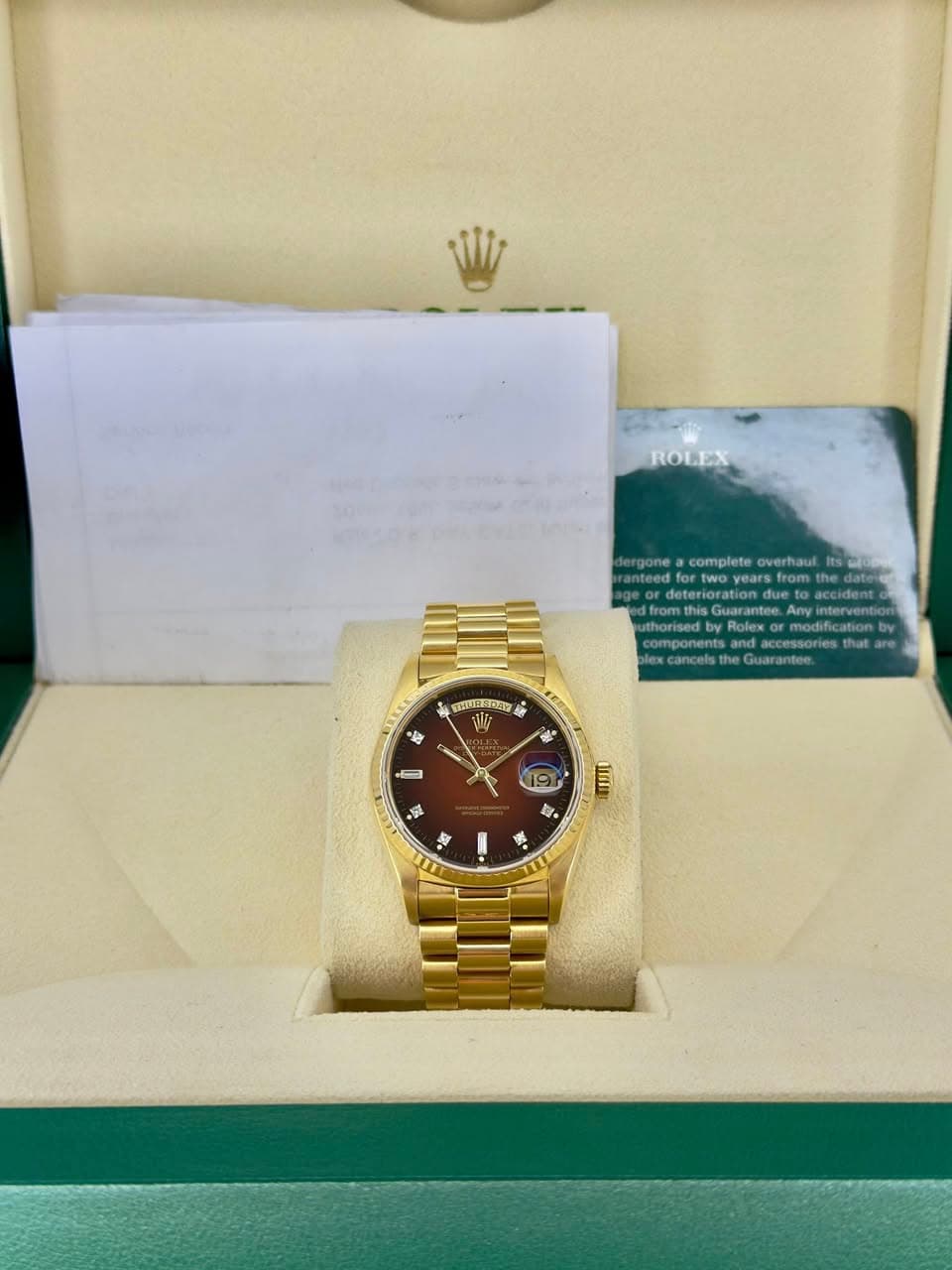May be an image of wrist watch and text