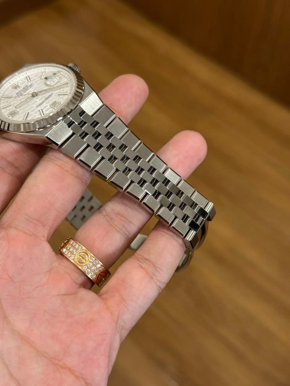 May be an image of wrist watch and text