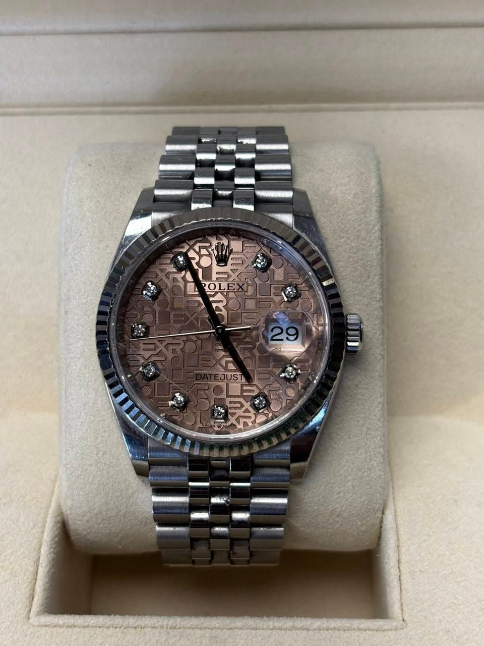 May be an image of wrist watch and text