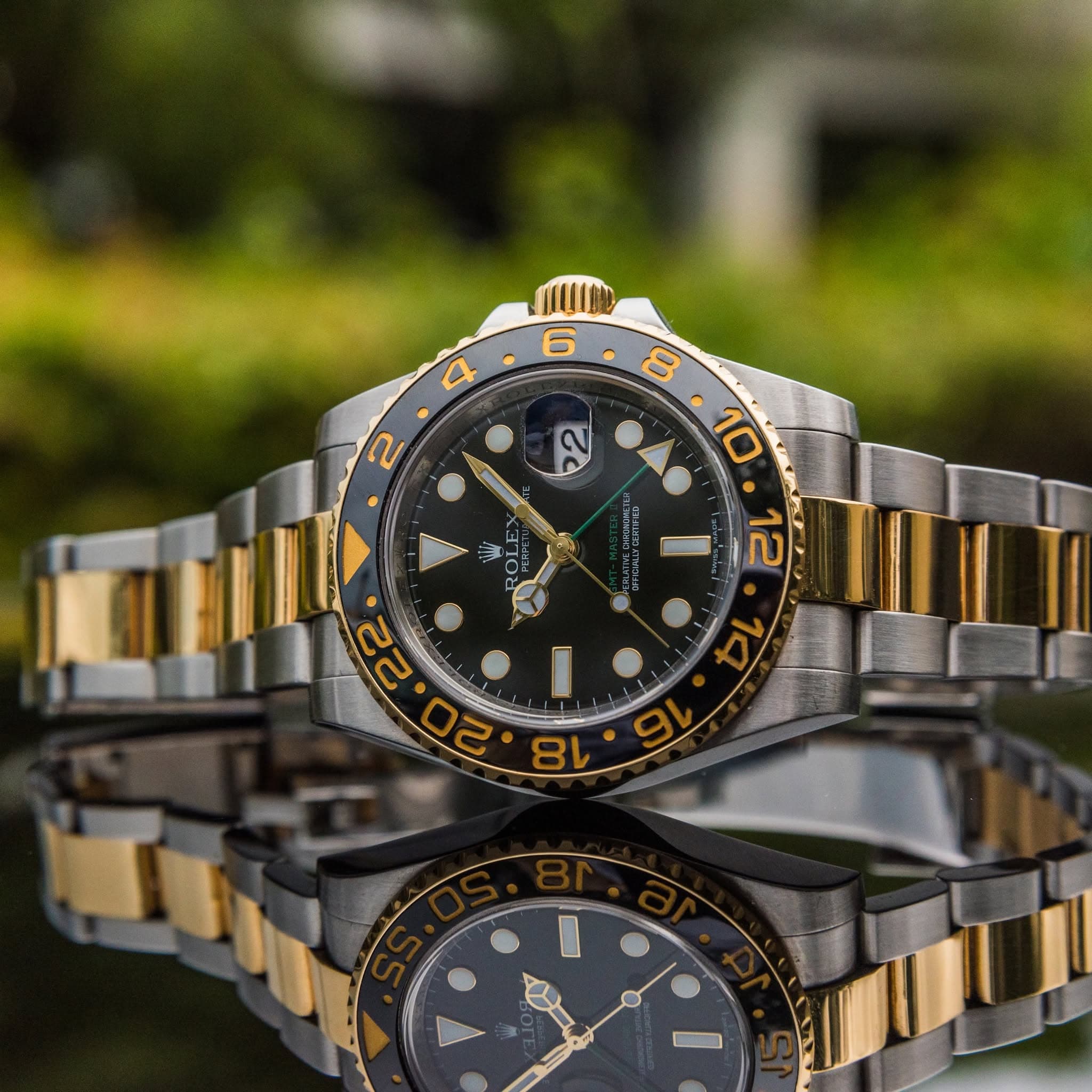 May be an image of wrist watch and text
