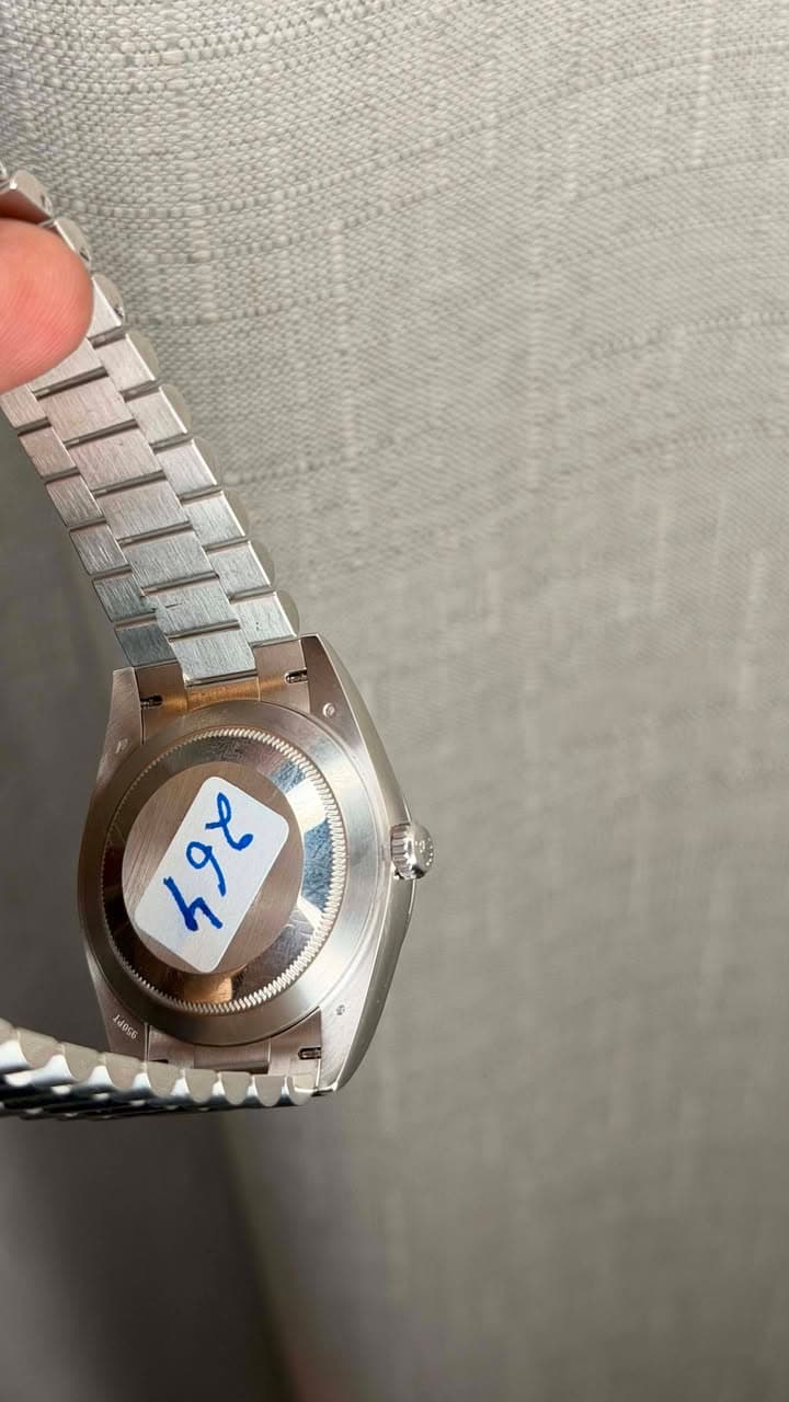 May be an image of wrist watch and text