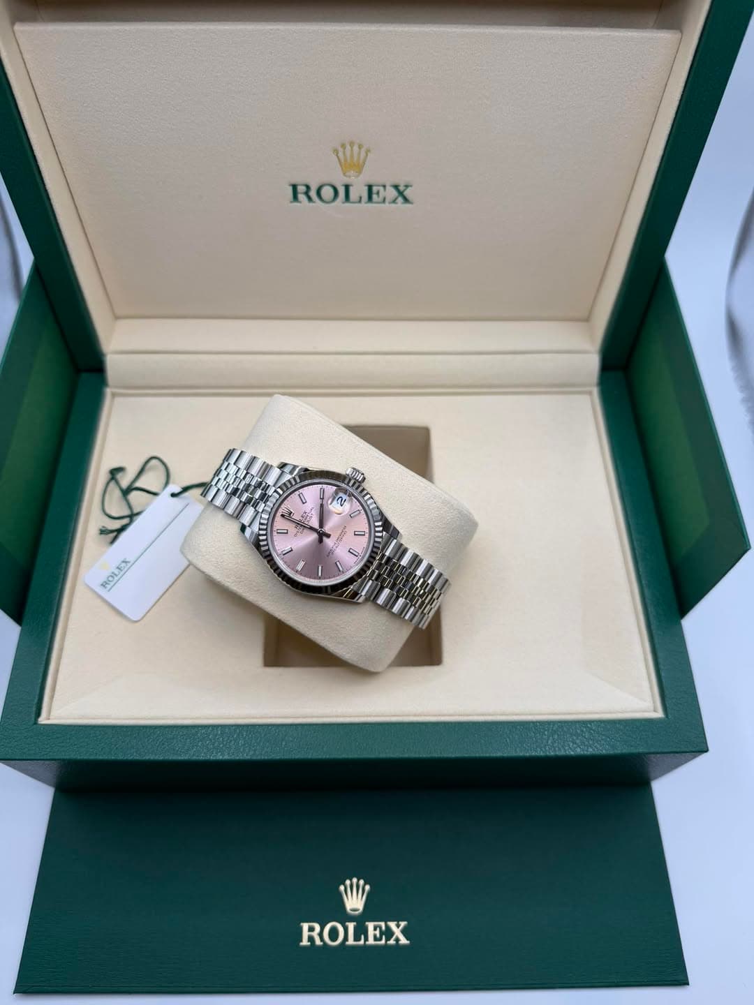 May be an image of wrist watch and text
