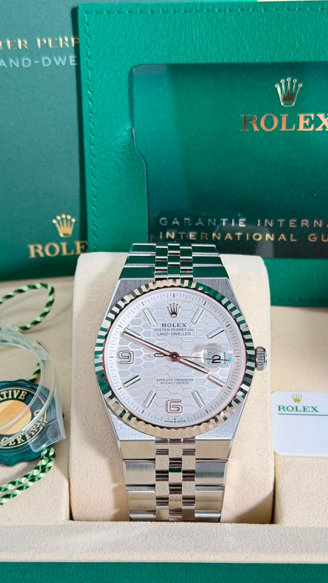 May be an image of wrist watch and text
