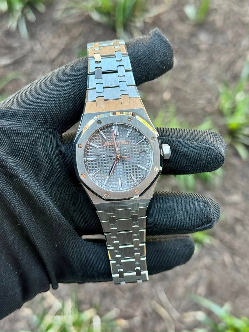 May be an image of wrist watch and text