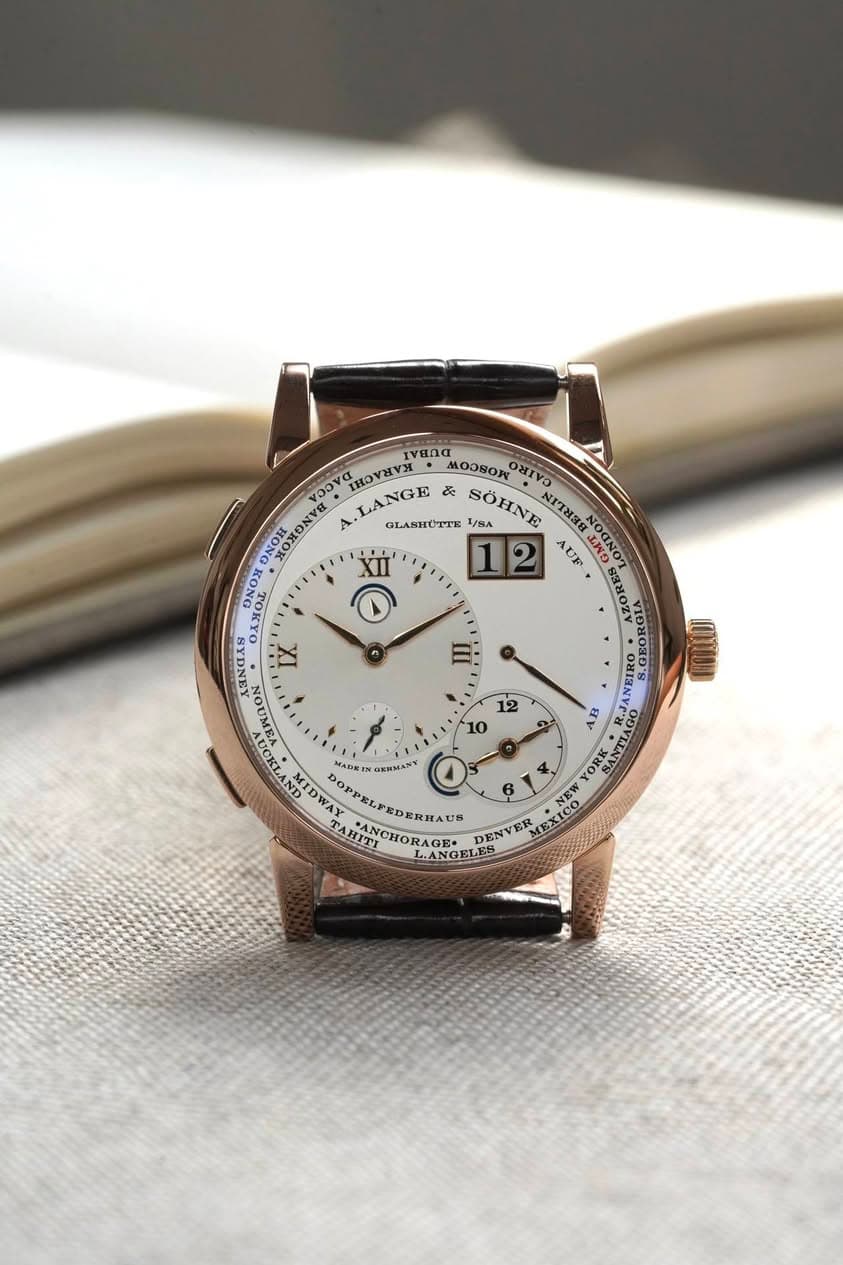 May be an image of wrist watch and text