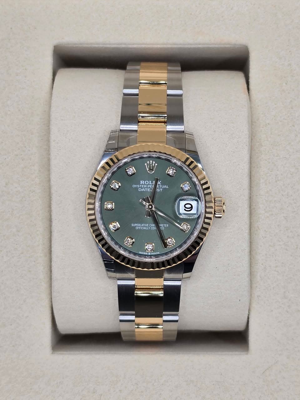 May be an image of wrist watch and text