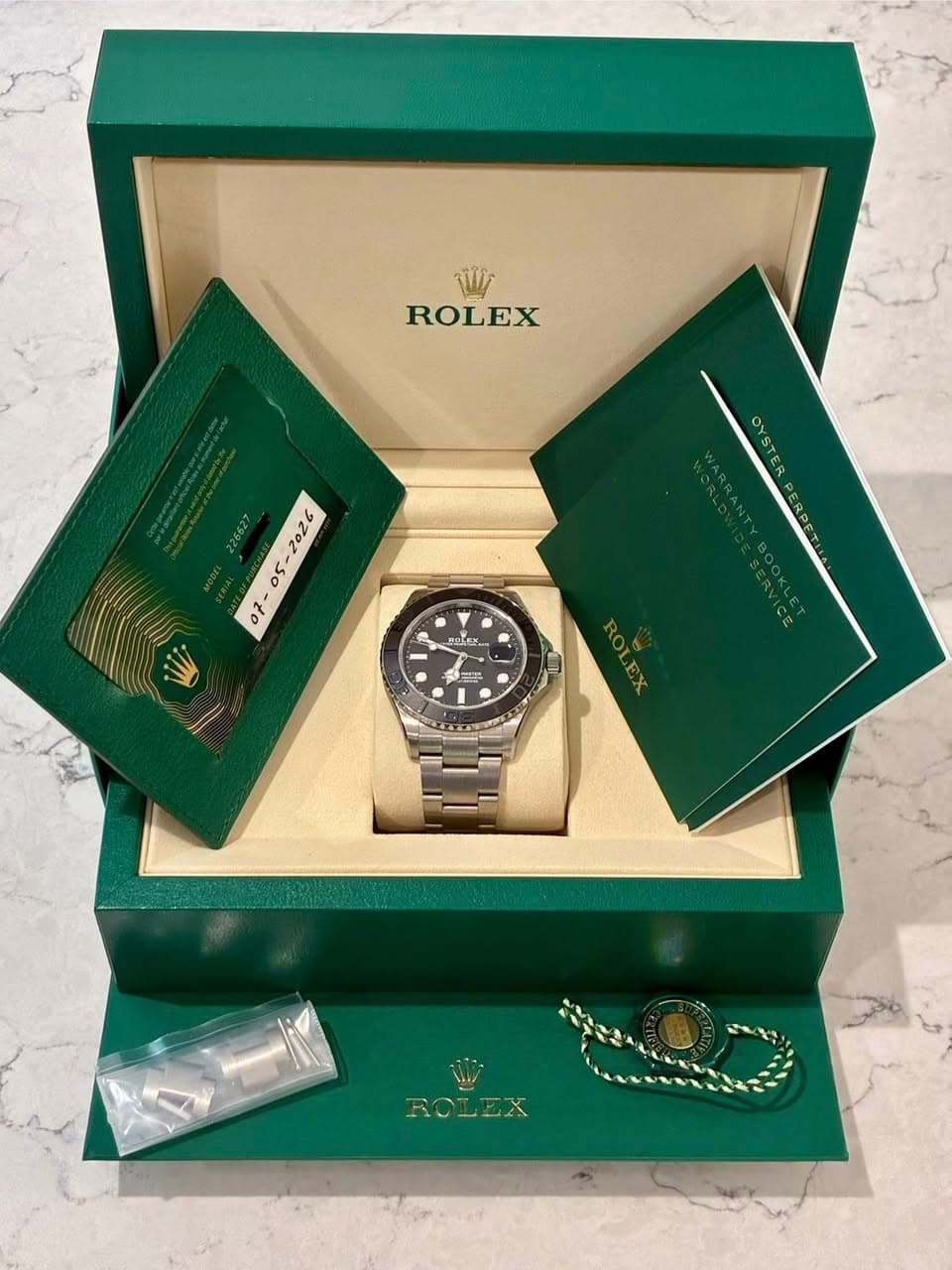May be an image of wrist watch and text that says '亚 ROLEX 2026 05 0f 。 ROLEX'