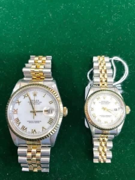 May be an image of wrist watch and text