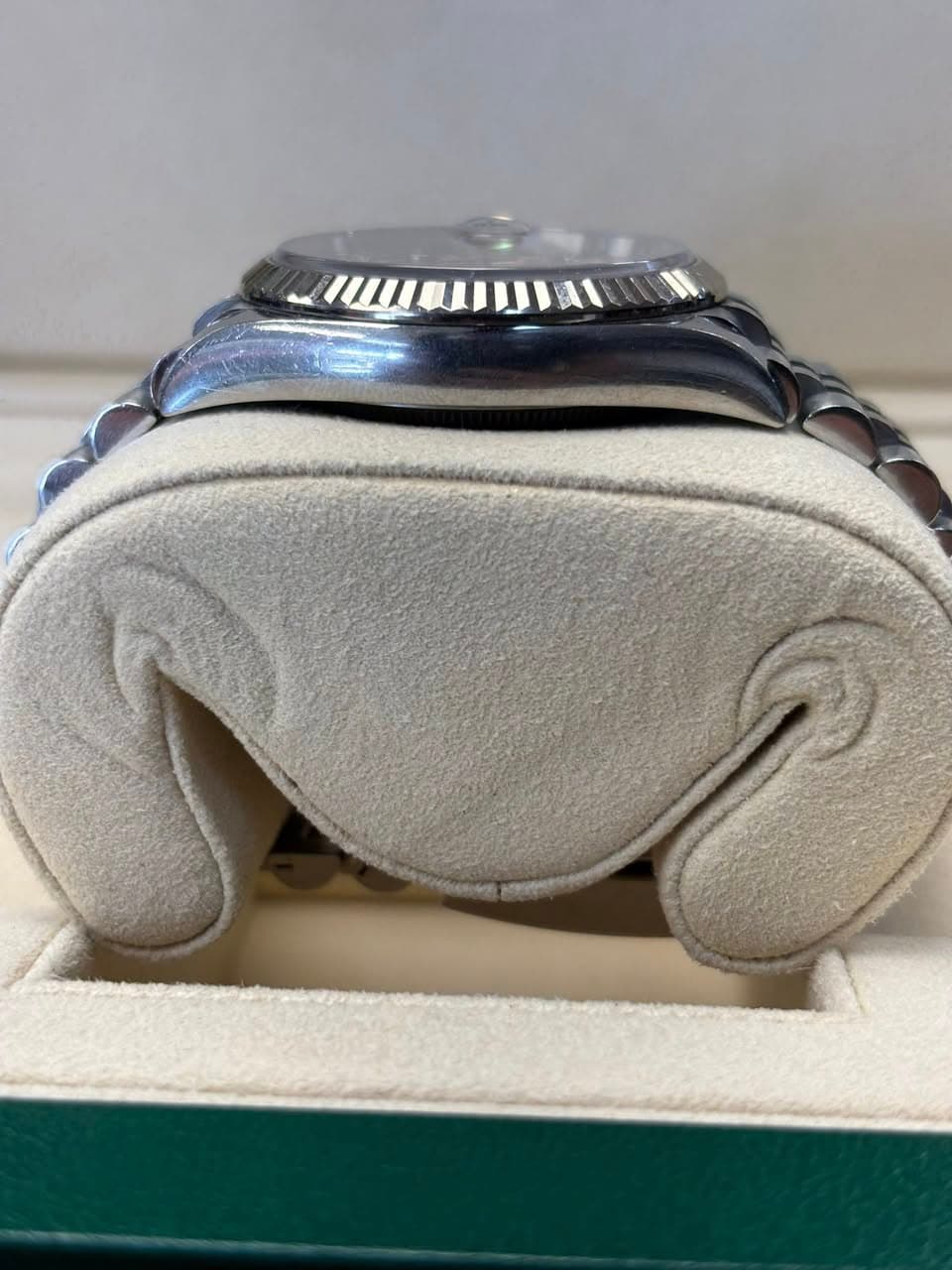 May be an image of wrist watch, leather, saddle-stitched leather and ring