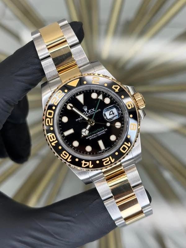 May be an image of wrist watch and text