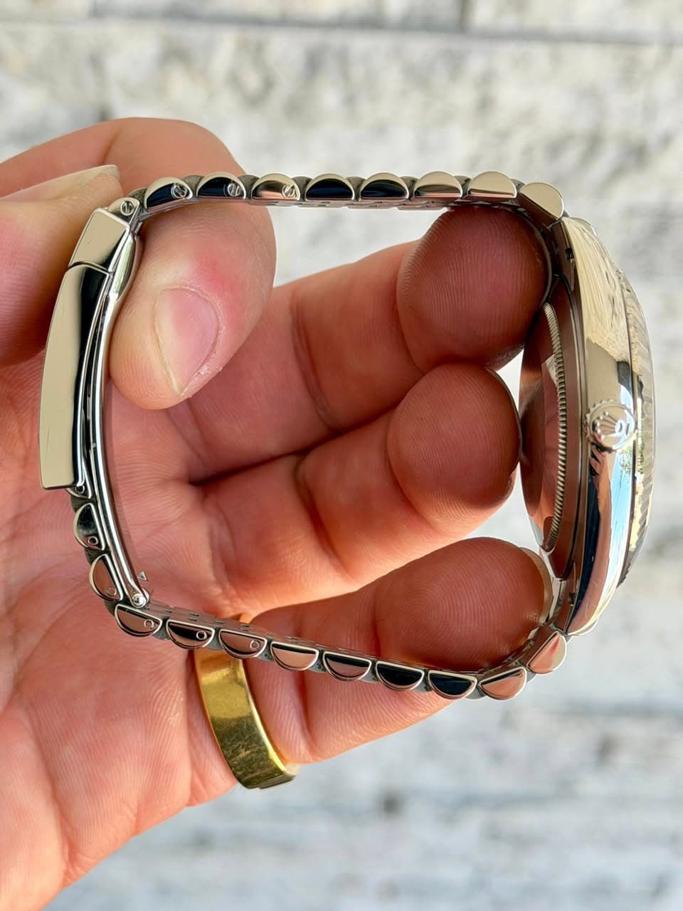 May be an image of jewelry and wrist watch