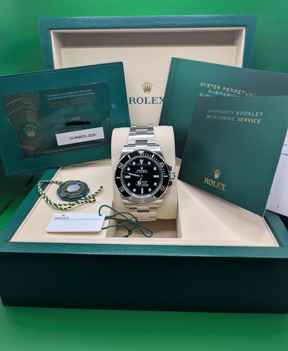 May be an image of wrist watch and text that says 'vli ROLEX OYSTER SUGUBMARIA SSUBPERPETUA PERPETUA 19.MARCH.2026 MARCH 2026 WARRANTY K BOOKL ET WUSLDWIDESERVICE WORLDWIDE SERVICE…