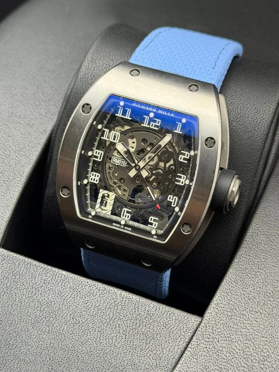 May be an image of wrist watch and text