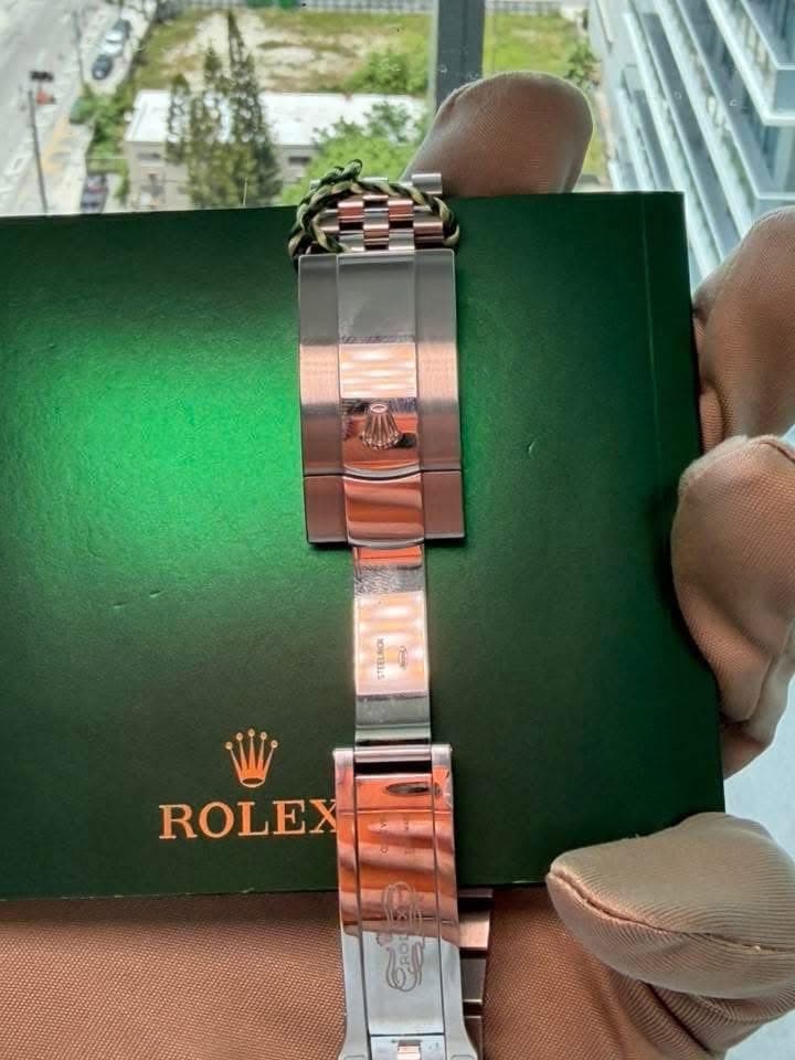 May be an image of wrist watch and text that says 'ROLEX'