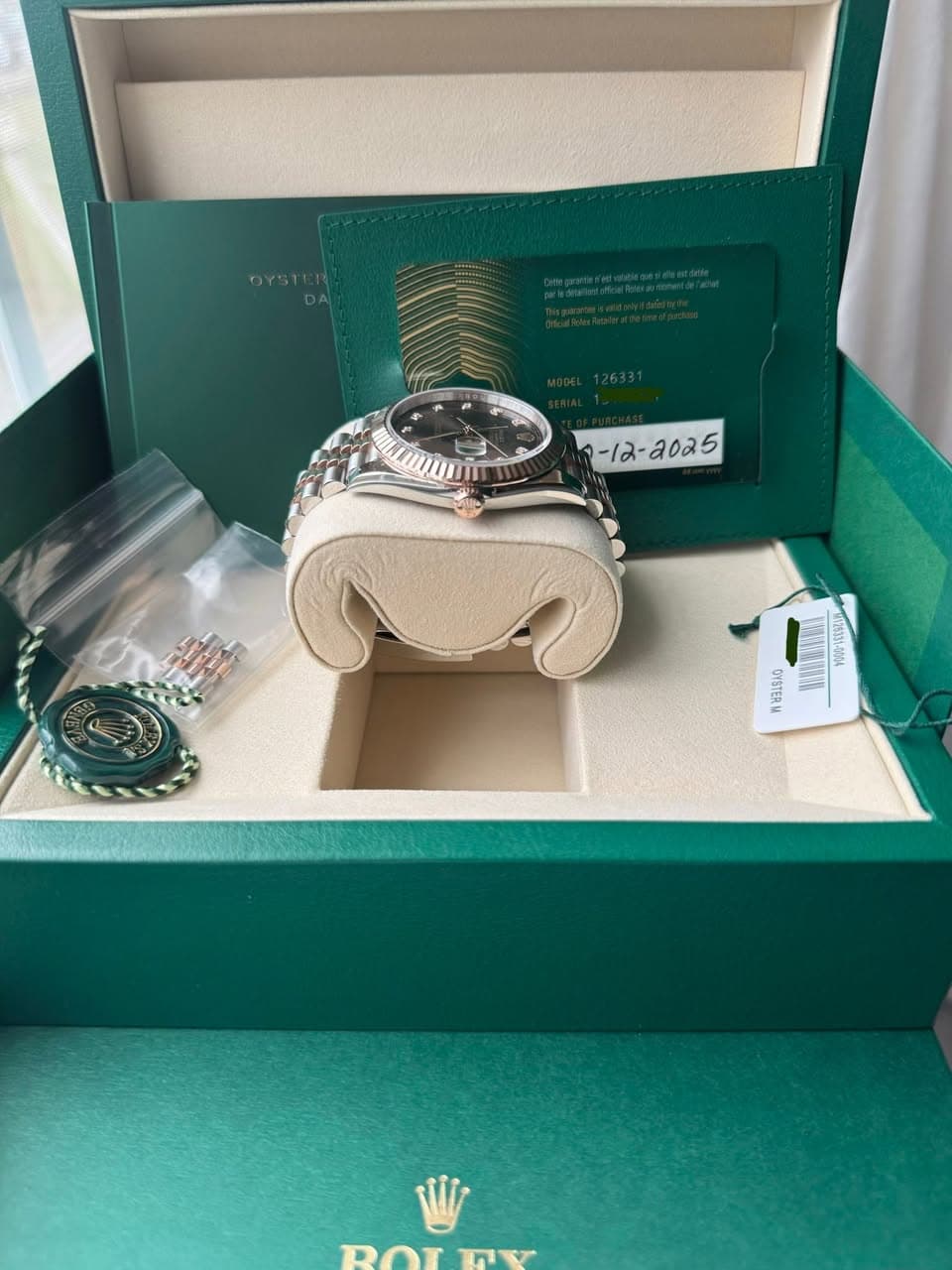 May be an image of wrist watch and text